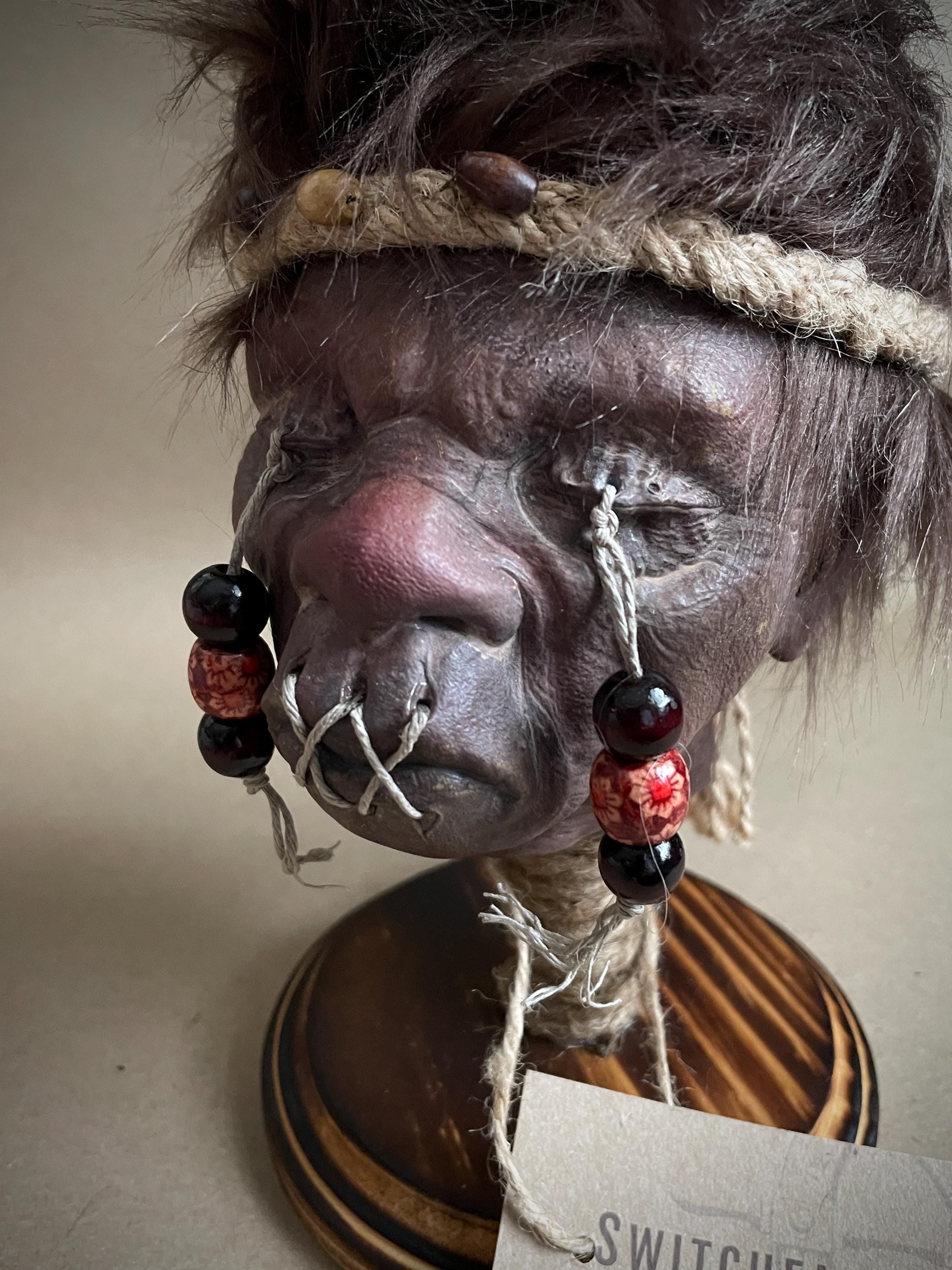 Elder Shrunken Head – Dark Brown Tsantsa Artifact with Stand