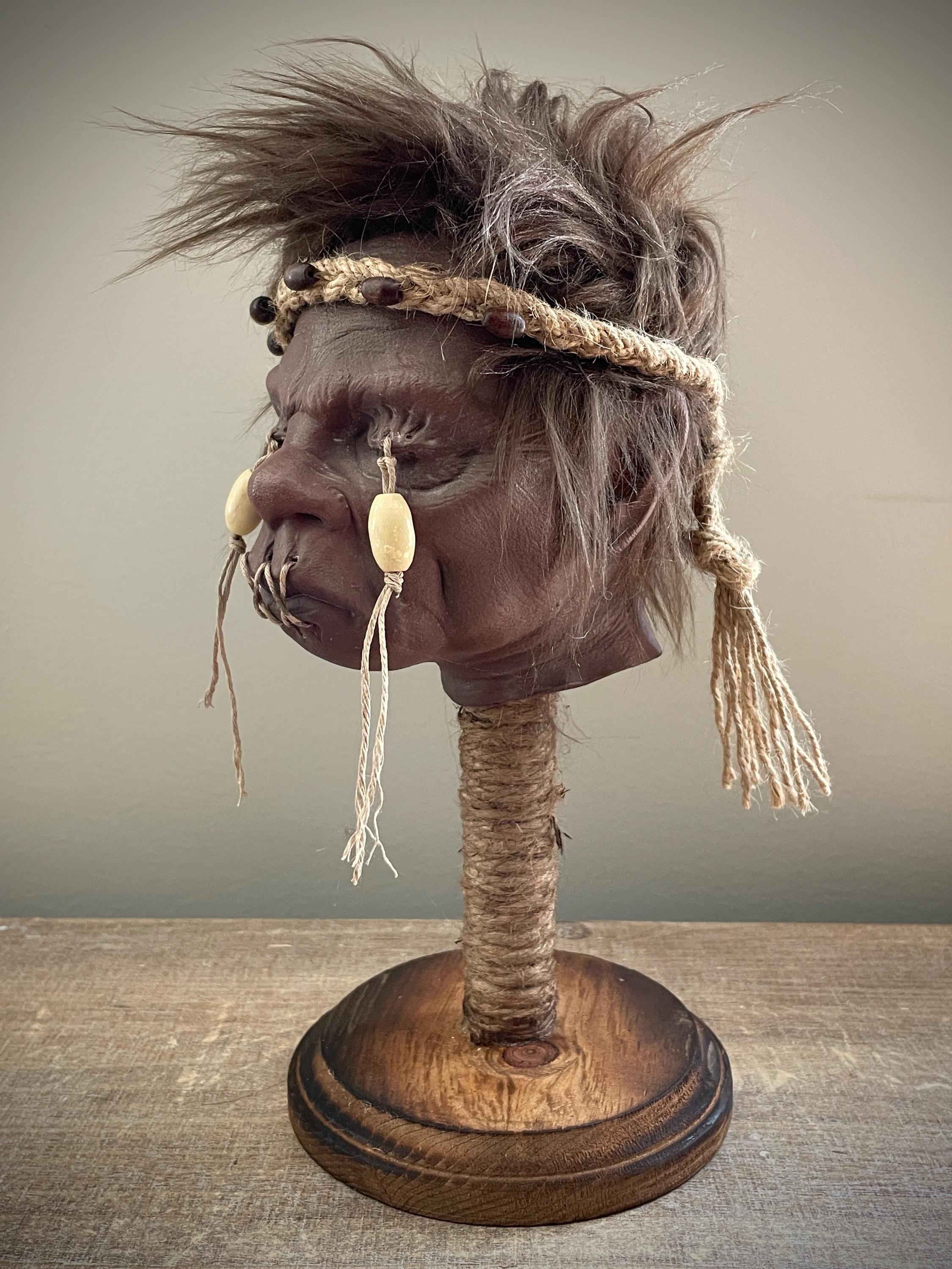 Elder Shrunken Head – Dark Brown Tsantsa Artifact with Stand