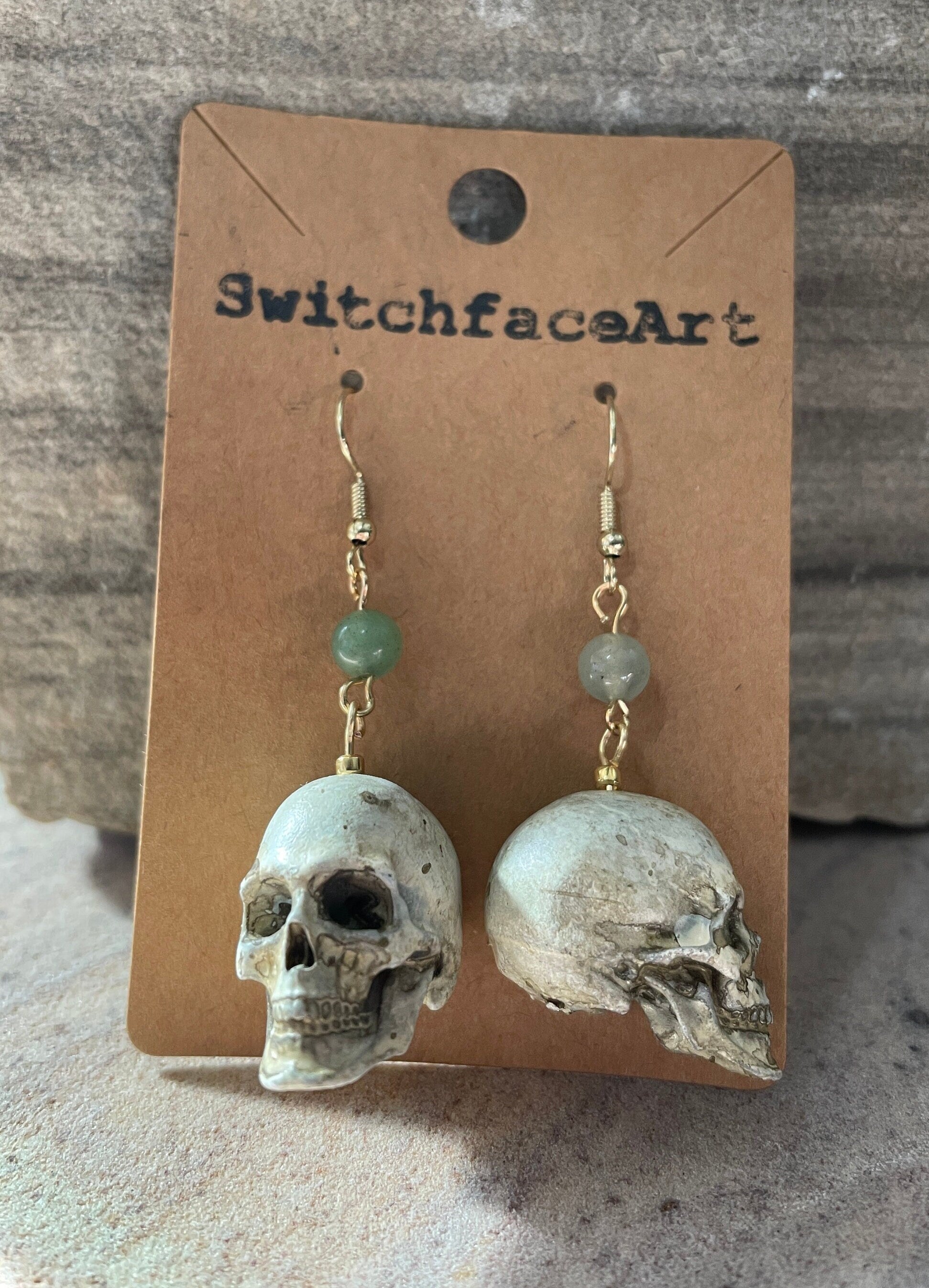 White Skull with jade Bead