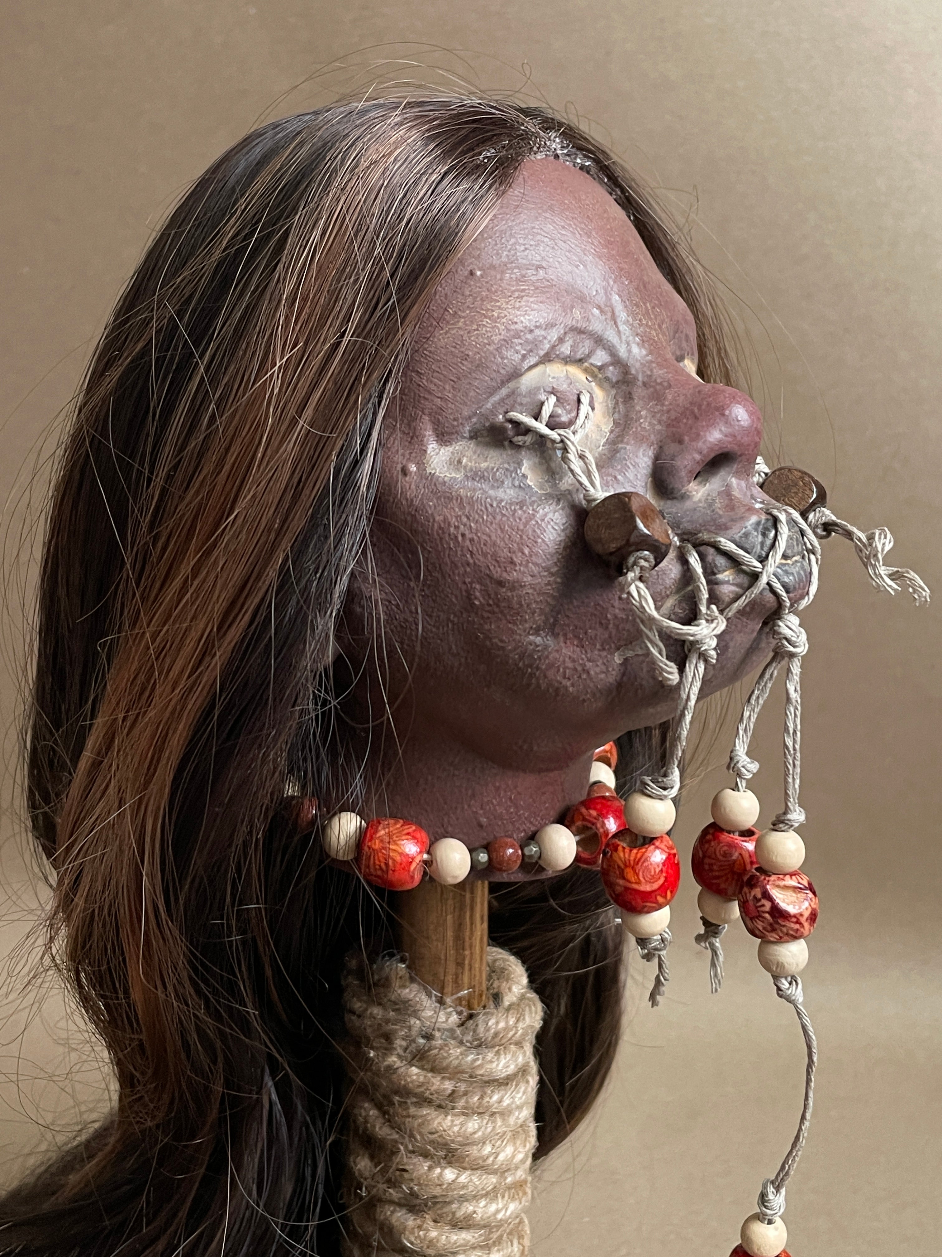 Long Hair Maiden Shrunken Head – Tsantsa Artifact with Display Stand