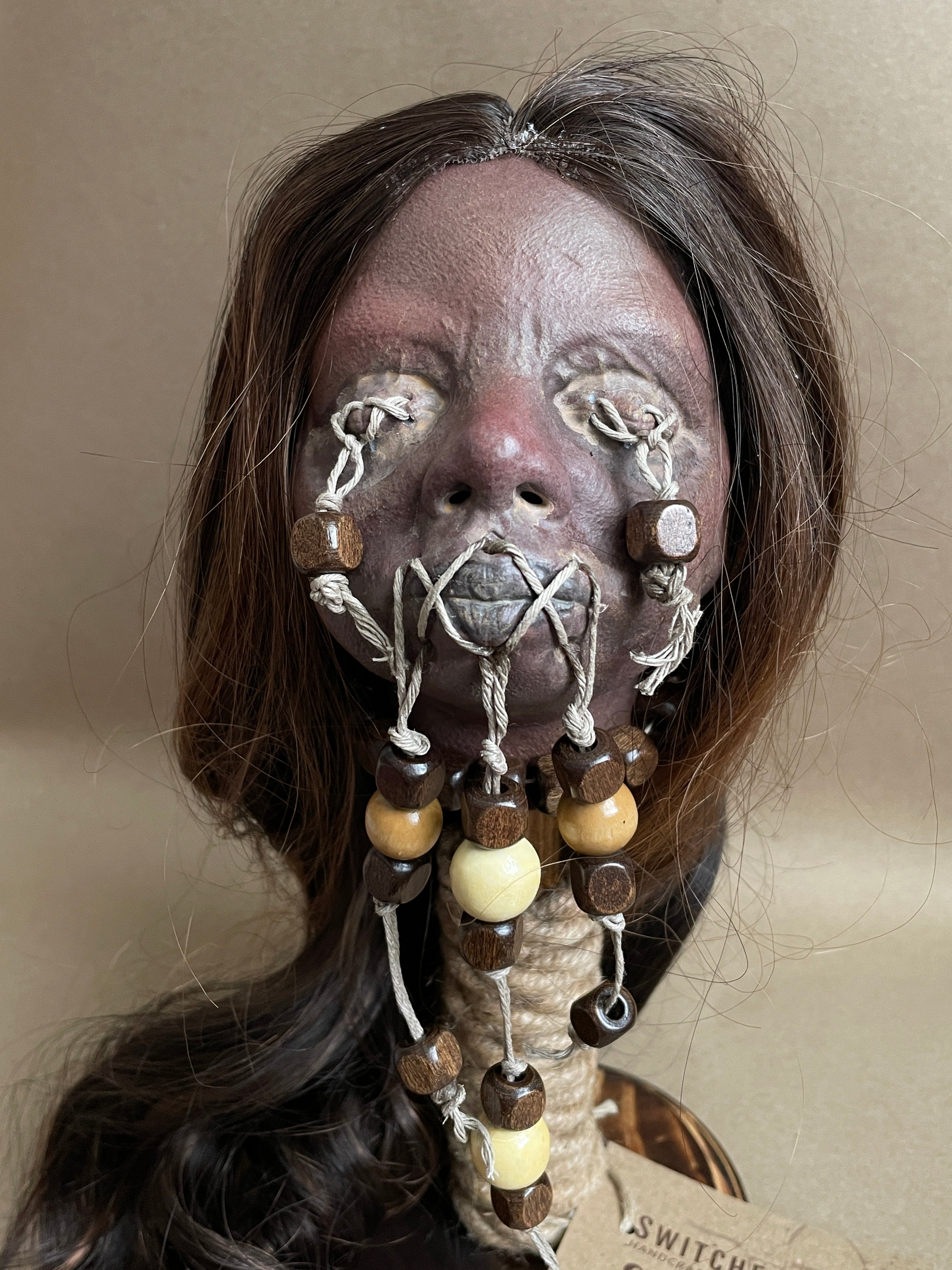 Long Hair Maiden Shrunken Head – Tsantsa Artifact with Display Stand