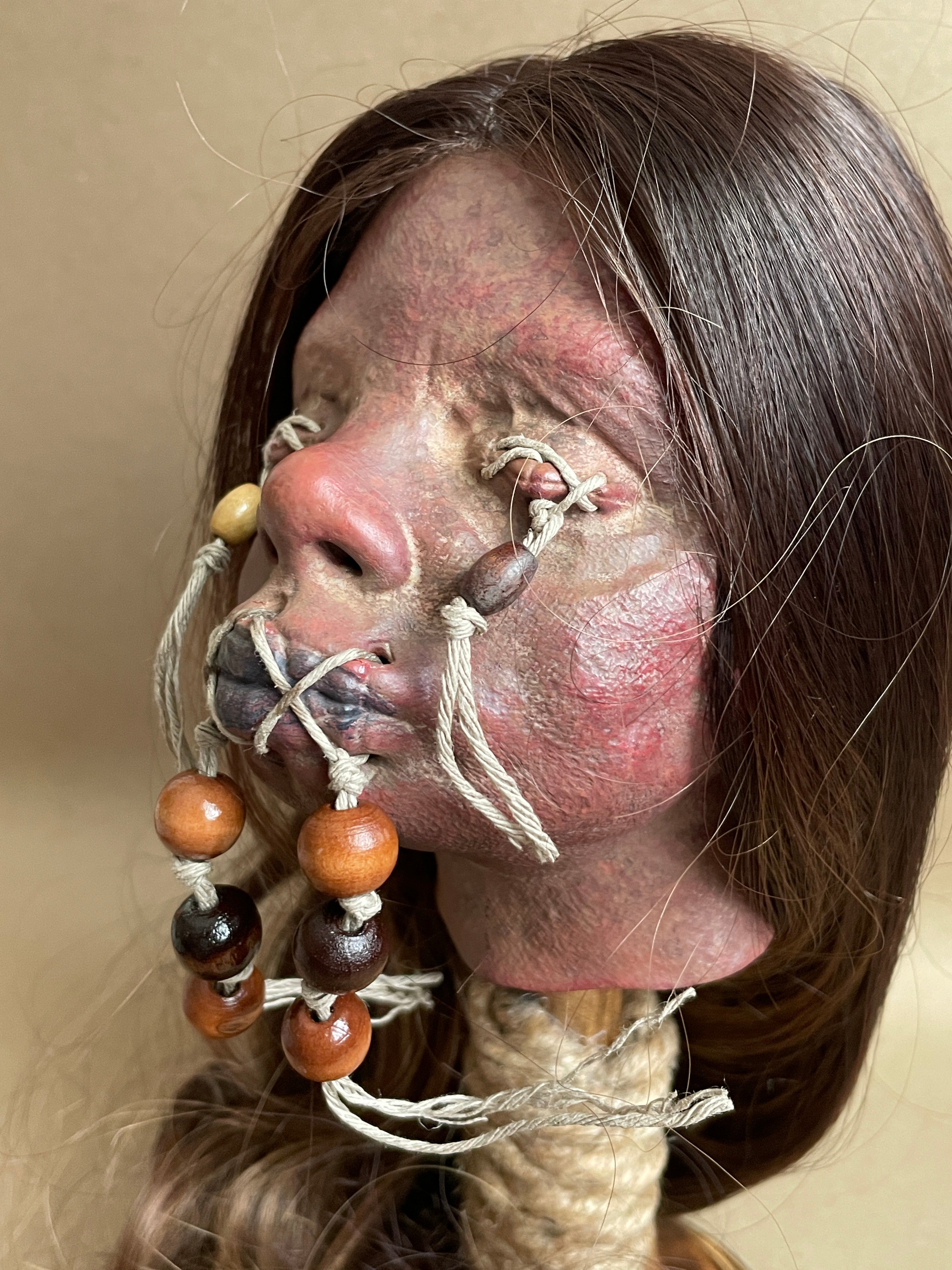 Long Hair Maiden Shrunken Head – Tsantsa Artifact with Display Stand