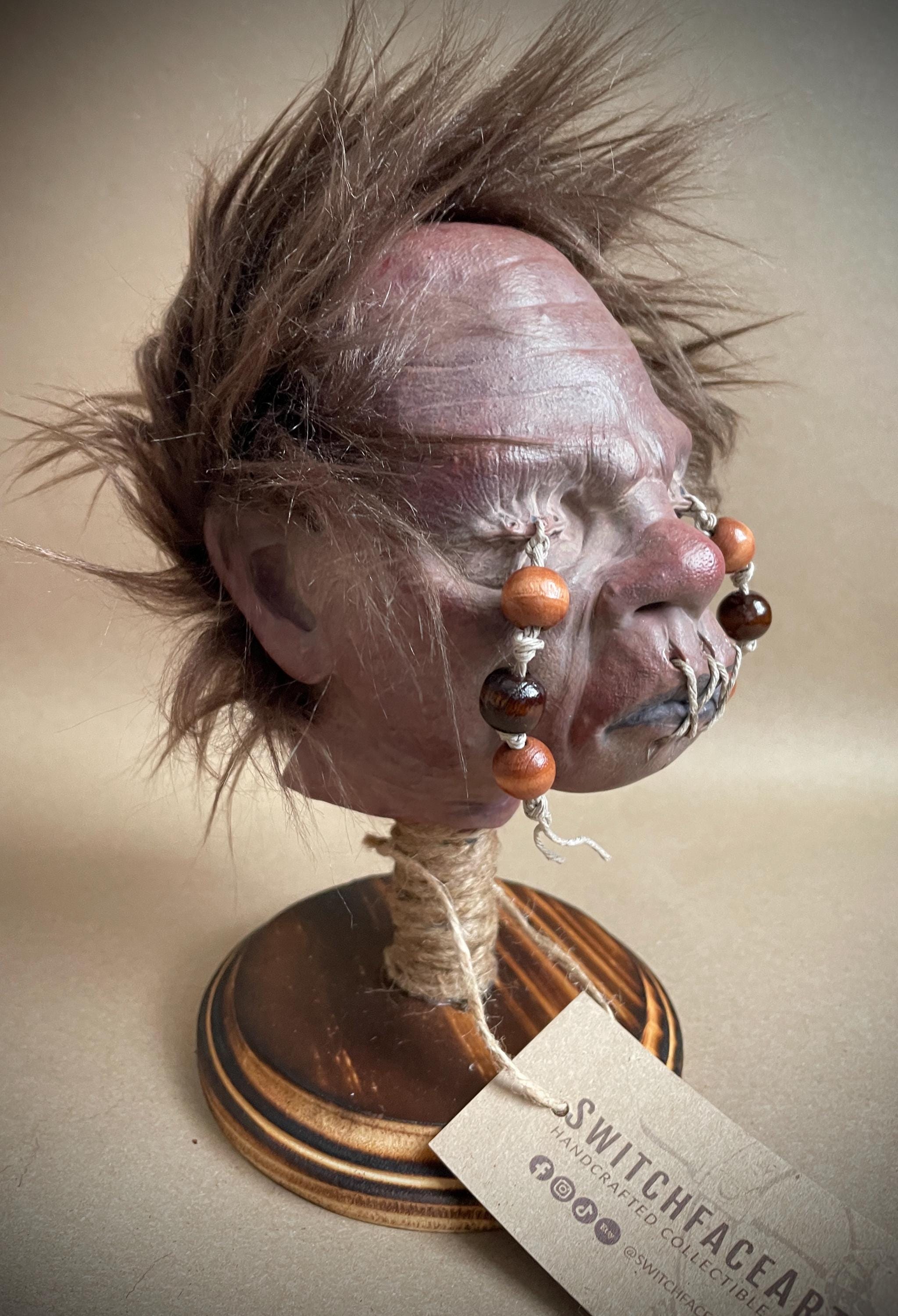 Elder Shrunken Head – Dark Brown Tsantsa Artifact with Stand