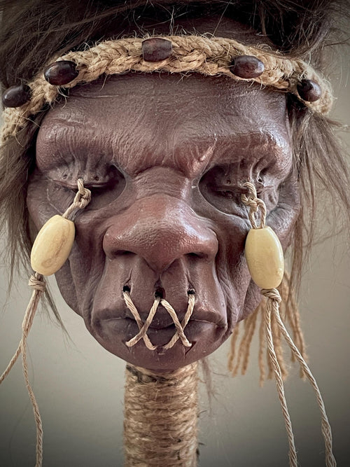 Elder Shrunken Head – Dark Brown Tsantsa Artifact with Stand