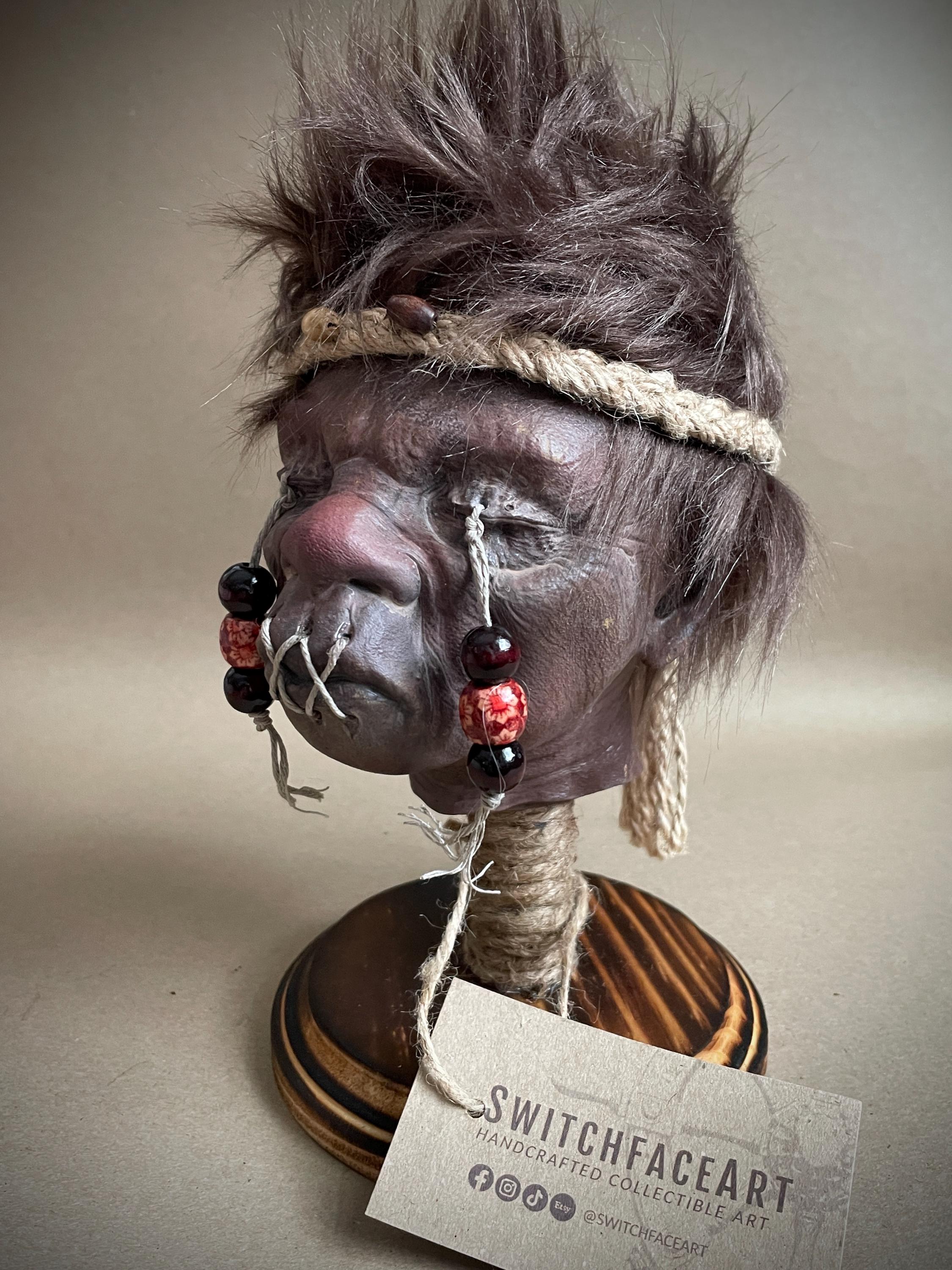 Elder Shrunken Head – Dark Brown Tsantsa Artifact with Stand